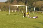 fc pionsat st hilaire 3rd XI shot on goal a s charensat goalkeeper saves with leg football french pyramid level 14 foot 02 mai may 2009 copyright free photo royalty free photo
